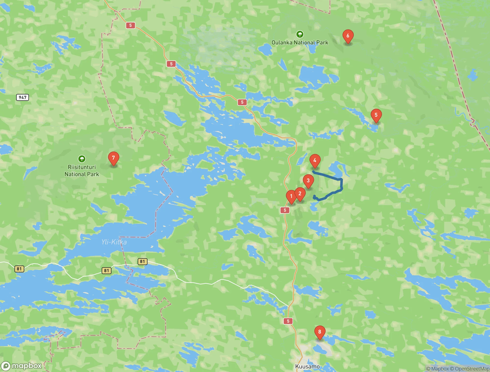 Map of the Ruka and Kuusamo area in northern Finland. Numbered pins mark Ruka Village, the Saarua first-snow trail, Valtavaara, Konttainen, the Juuma trailhead for the Pieni Karhunkierros loop, the Oulanka visitor centre, the Riisitunturi starting point and Kuusamo Airport, with a blue line showing the ridge walk between Valtavaara and Konttainen.