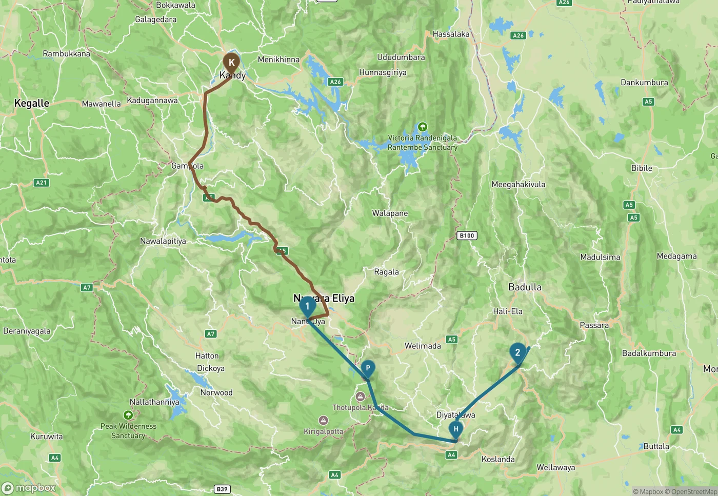 Map of Sri Lanka's hill country showing the current split in the Main Line. A brown road route runs from Kandy south through Gampola and down to Nanu Oya near Nuwara Eliya, covering the section of railway still under repair. A blue line continues from Nanu Oya marked 1, east past Pattipola marked P and Haputale marked H, to Ella marked 2 and on towards Demodara, representing the restored and operating rail section.