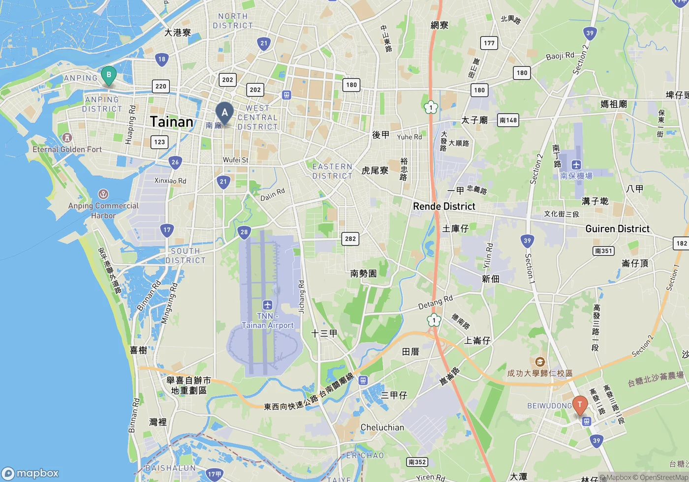 Locator map of Tainan in southwest Taiwan, showing A the West Central District food core, B Anping on the coast, and T the high speed rail station at Shalun southeast of the city.