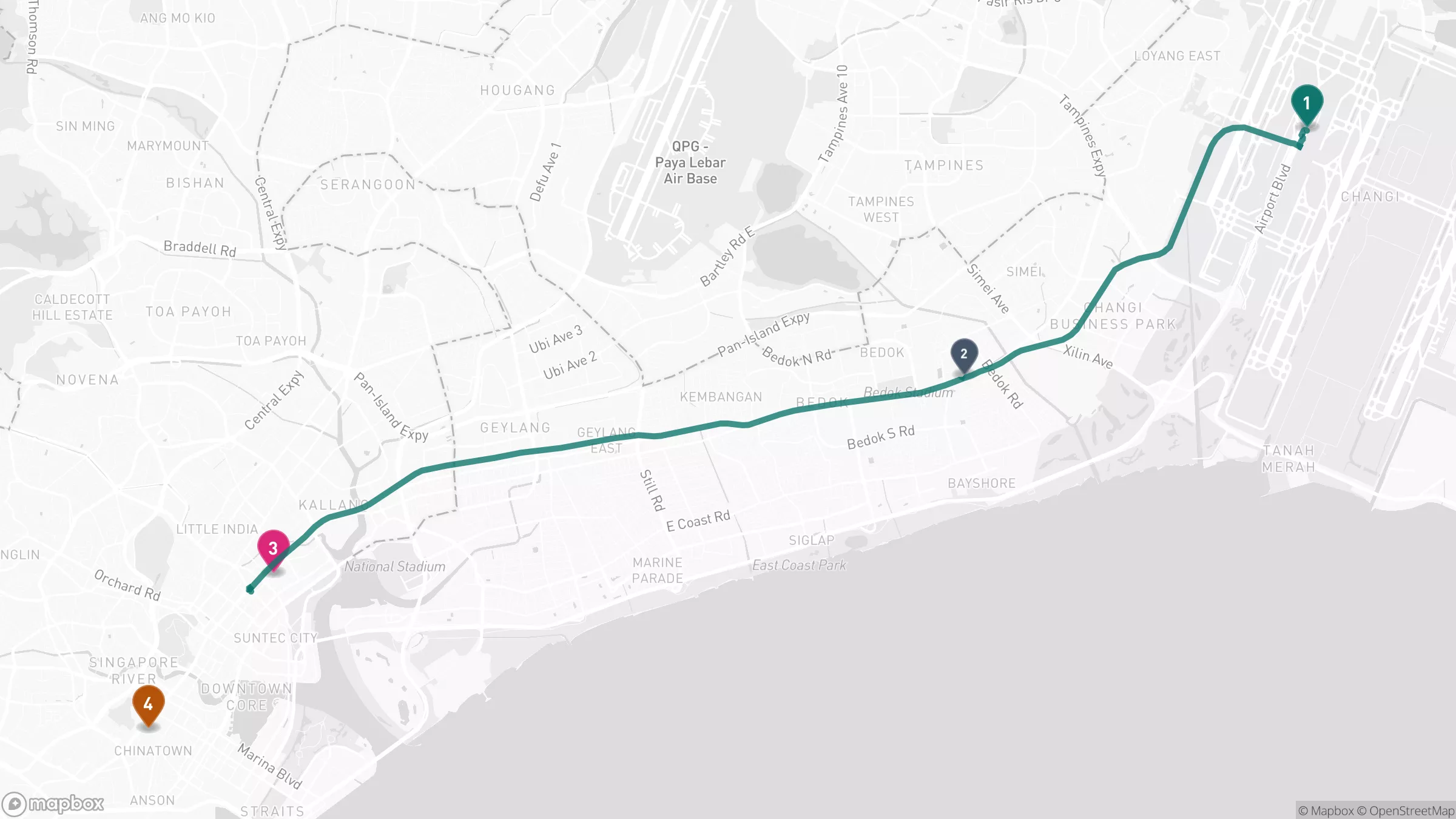 Map of Singapore showing Changi Airport in the east, the Tanah Merah transfer point, Kampong Glam near Bugis in the city centre, and Chinatown to the southwest, with the rail route from the airport to the city drawn across the island.