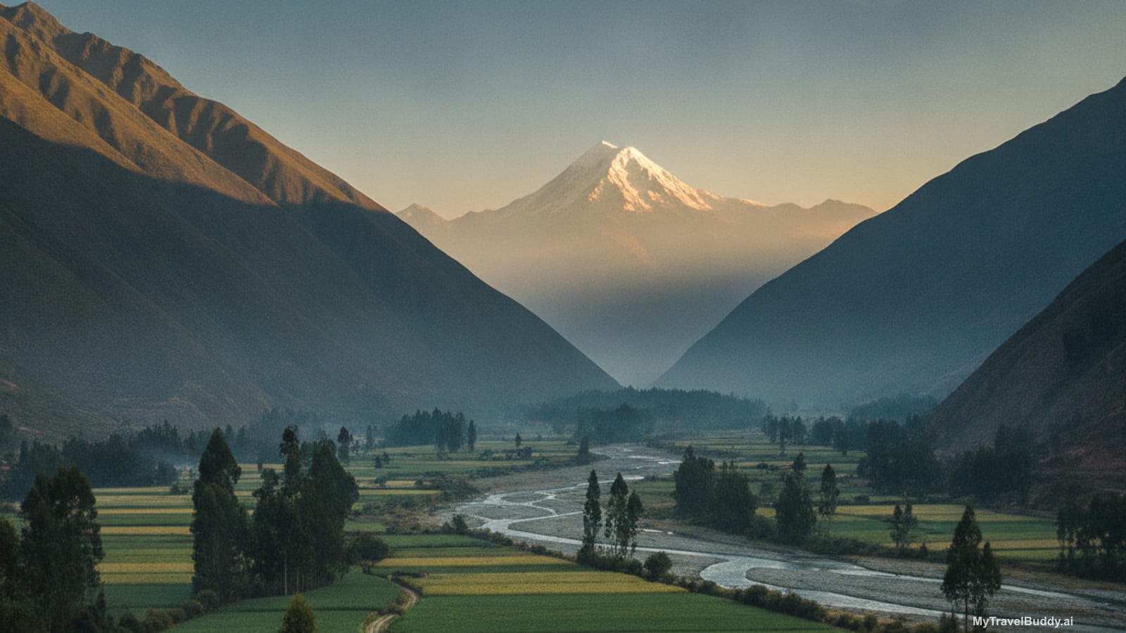 Early morning in the Sacred Valley of Peru: a flat green valley floor of small maize and alfalfa fields divided by low adobe walls and tall eucalyptus trees, a shallow braided river running through the middle, steep brown Andean slopes on both sides, and a single snow-dusted peak at the head of the valley catching the first warm sunlight while the fields are still in blue shadow.